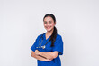 © Mdv Edwards - Confident young Asian female caregiver in blue scrubs with a stethoscope, isolated on white