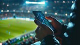 Fototapeta  - Online soccer bets being placed by a man on his cell phone