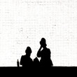 silhouette of a couple sitting on a bench