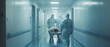 © Антон Сальников - Surgeons, nurses and doctors move an injured patient through hospital corridors on a stretcher. A staff member is in a rush to get the patient to the operating room.