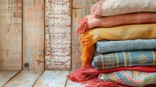 Stack Of Colorful Woven Fabrics On Wooden Background