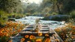 An idyllic riverside picnic table adorned with plates, glasses, and wildflower