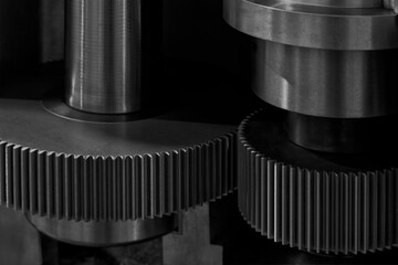 Poster - Two gears are shown in close up, one of which is missing a tooth. Concept of precision and complexity, as gears are essential components in many machines and mechanisms