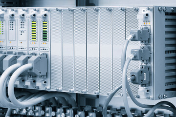 Poster - A row of computer cables with a clock on the left side.