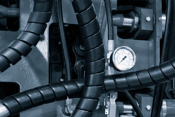 Aufkleber - A close up of a pressure gauge on a machine. The gauge is white and black and has a black face