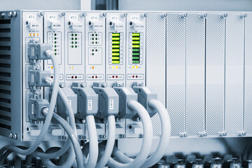 Poster - A row of computer cables with a clock on the left side.