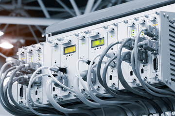 Poster - A row of computer cables with a clock on the left side.