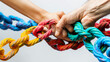 Two hands tightly gripping a multicolored rope in a symbol of teamwork or struggle.
