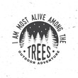 I am most alive among the trees. Vector illustration. Concept for shirt or logo, print, stamp or tee. Vintage typography design with forest and starry night sky silhouette