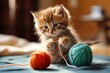 A playful kitten with a yarn ball.
