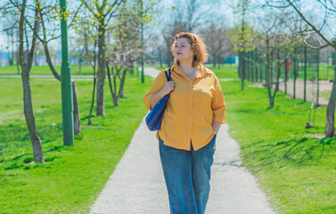 Pretty American middle age woman in vacation or at city. Size plus and xxl woman. Life of plump people in everyday life, faith in herself. Concept of life modern woman