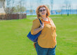 Pretty American middle age woman in vacation or at city. Size plus and xxl woman. Life of plump people in everyday life, faith in herself. Concept of life modern woman