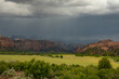 Rain Storm Moves Over the Mountains of Zion with green field
