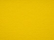 Vibrant mustard yellow felt surface radiating warmth and cheerful energy