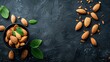   Dark backdrop featuring a bowl of almonds topped with green leaves - insert text or image here