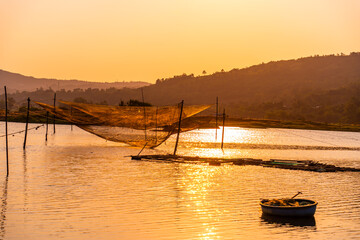 Wall Mural - View of fishing net on Phu Ngan near Ong Cop bridge or Tiger wooden bridge, Vietnam's longest wooden bridge in Phu Yen province, Vietnam.