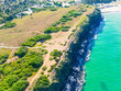 Aerial view of Bai Xep beach in Phu Yen province, Vietnam. Tropical coast from cliff above. Vietnam travel destination, golden sand beach waving sea rock boulders.