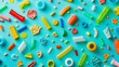 Close-up assortment of colorful recyclable plastics, each piece prominently positioned against a turquoise background to underline the need for effective waste management