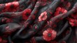Close up detail of red flowers on black fabric as background texture.