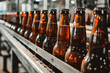Full brown beer bottles on the conveyor belt in the brewery