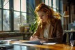 © LidiaLens - Redhead woman in suit working in a bright office with plants