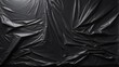 Textured plastic wrap overlay on black backdrop.