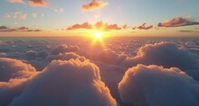   The Sun Sets Behind Clouds In The Sky, Viewed From A Plane Window On A Sunny Day