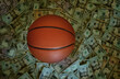 Basketball on a pile of cash -- sports betting concept