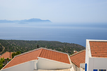 Wall Mural - The mountain village of Nikia – characteristic Greek isles architecture, views of a Aegean Sea