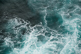 Fototapeta  - Moody Seascape: Dark Blue Waves Crashing with Dramatic Sky