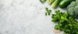 Raw fresh green vegetables, unprocessed grains set on a light grey marble kitchen counter, seen from above with space for text. Healthy eating concept emphasizing clean, vegan, vegetarian, detox,