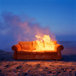 Burning orange sofa on the beach at night