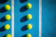 Tennis balls on the court. Top view. Sport background.