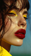 Beautiful young woman with bright make-up, red lips and yellow eyeshadow