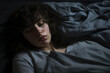 woman sleeping in bed at night, closeup portrait