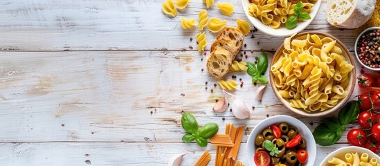 Wall Mural - Ingredients for Italian pasta arranged on a white wooden table from an overhead perspective, with space for additional content.