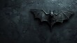 Bat is spread-winged against dark, wet background