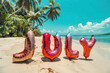 beach party decorations with shiny foil balloons spelling july on tropical beach