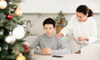Mom scolds her son for inappropriate behavior on Christmas holiday