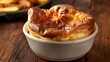A Yorkshire pudding is a classic British delicacy, known for its light, crispy outside and soft inside texture. Light and airy dough baked in the oven.