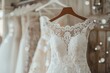 white wedding dress hanging on a rack, waiting for a bride-to-be to choose it