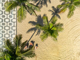 Fototapeta Mapy - Aerial top down view of palm trees on Ipanema Beach with famous mosaic boardwalk