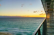 Sunrise over Cancun's coastline viewed from an architectural balcony, highlighting a peaceful ocean with gentle waves, under a pastel-colored sky. High quality photo. Cancun, Yucatan, Mexica