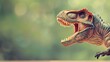 Toy dinosaur figurine with open mouth on blurred natural background