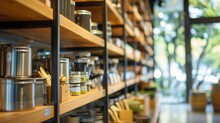 Glimpses Of A Zero Waste Stores Interior Can Be Seen In This Defocused Image With Blurred Shelves Lined With Stainless Steel Containers And Bamboo Utensils. The Soft Glow From Natural .