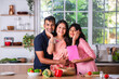 Mother's day or woman's day celebration of Indian small family in kitchen