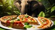 The elephant is enjoying the pizza with various toppings on the plate.