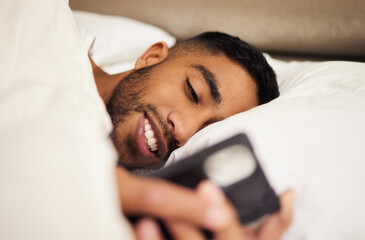 Poster - Man, bed and tired or phone for internet in home, pillow and network to scroll on social media. Male person, bedroom and reading on website, blanket and app for communication or chat in apartment