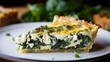Gluten-free quiche, close-up, with a golden flaky crust and a rich, savory filling of spinach and feta, on a vintage plate.
