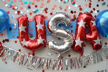 4th Of July Foil Balloons Shaped Text "USA" With US Flag Themed Blue And Red Balloons With Stars And Stripes In Background, Fringe And Confetti